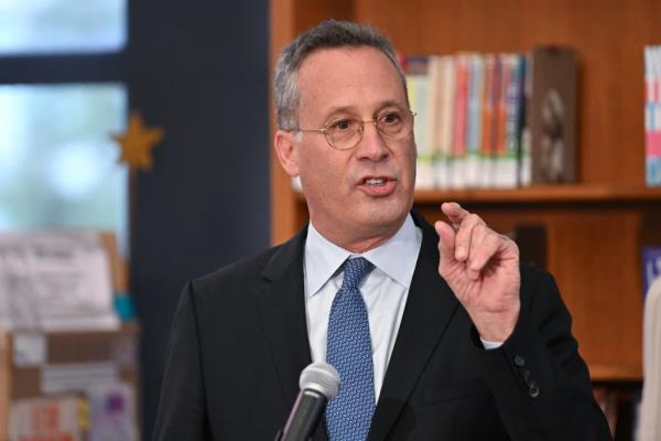 Anthony Marx speaking at a microphone